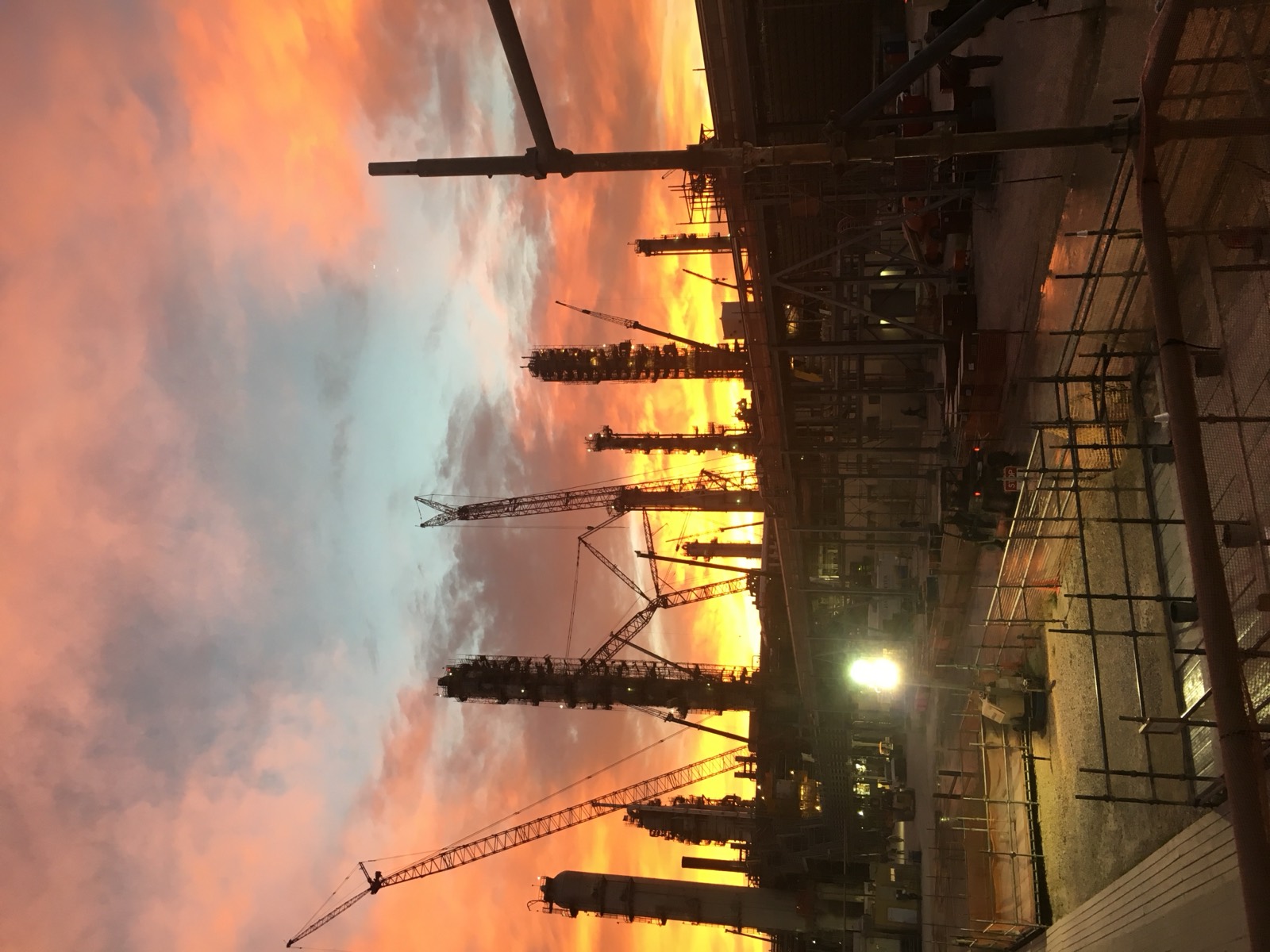 Refinery construction site at sunset